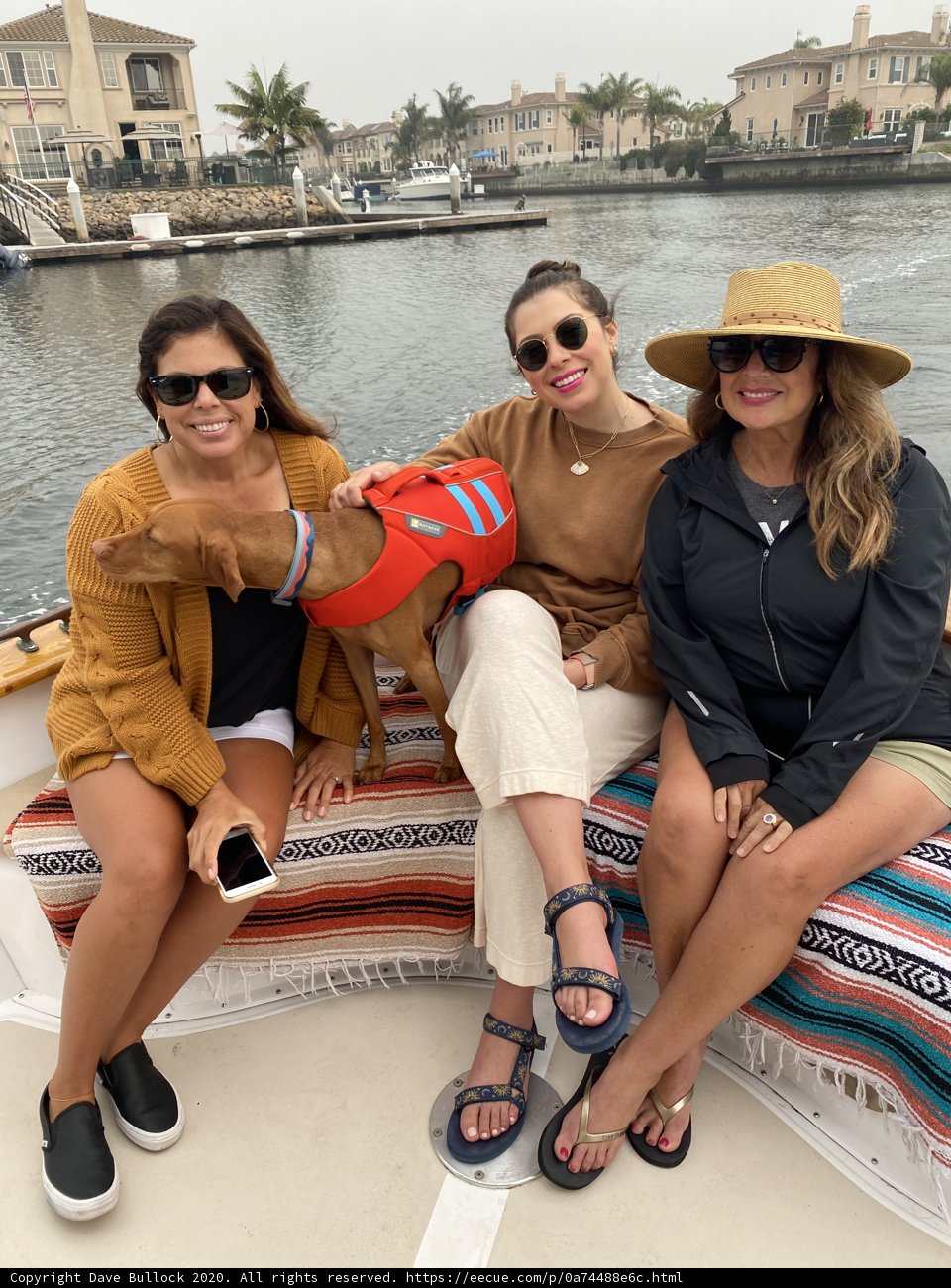 Three Women and a Dog Enjoying a Day on the Boat