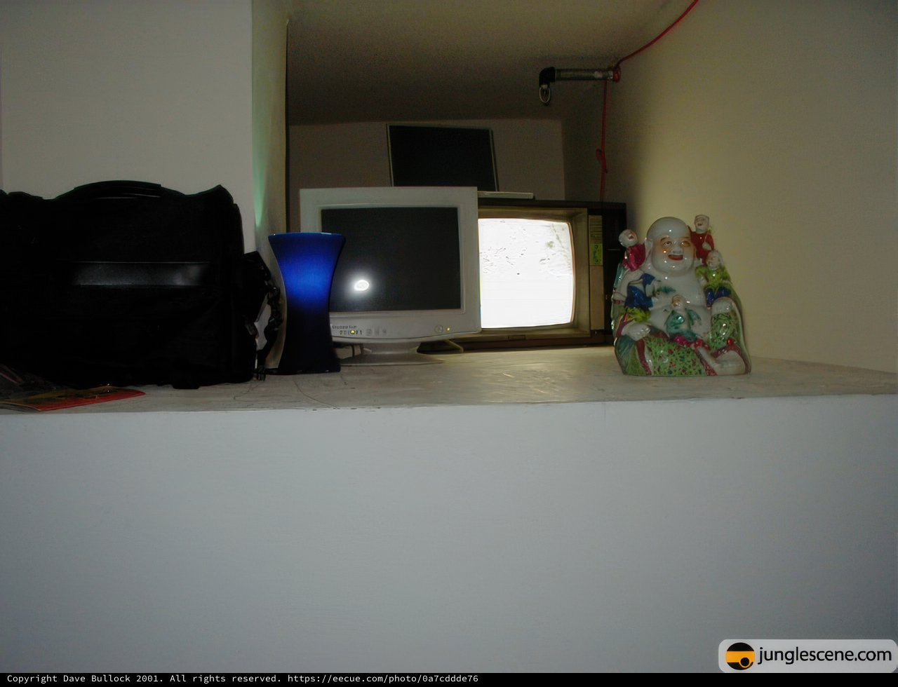 TV and Bag on the Shelf