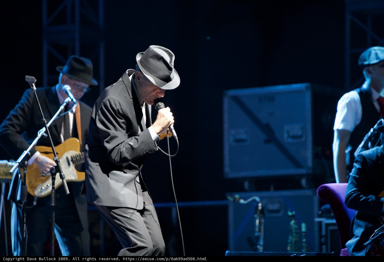 Leonard Cohen Takes the Stage in Fedora and Suit
