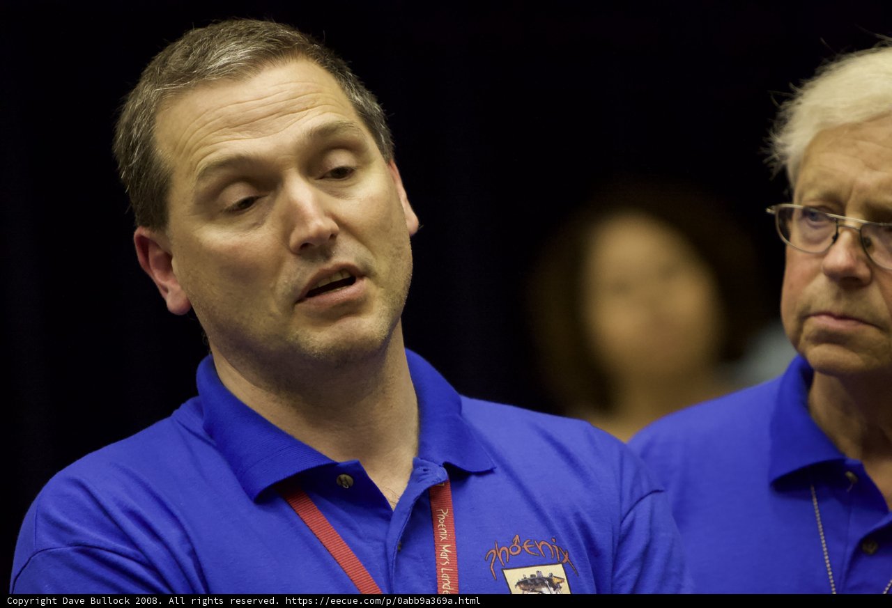 Two Men in Blue Shirts Posed for Post-Interview Photograph