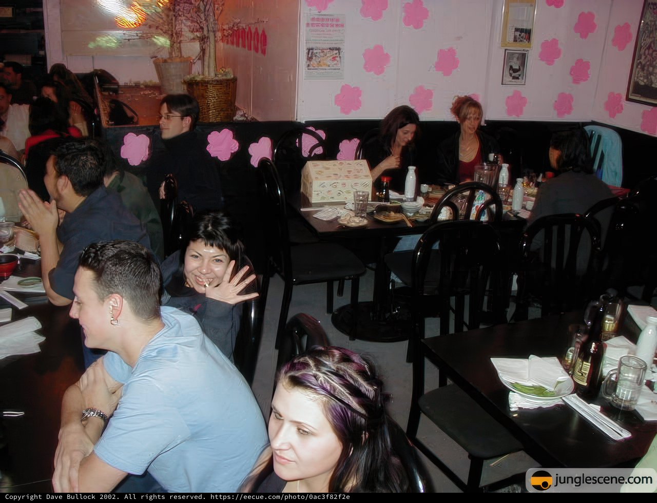 A Group of Friends Enjoying a Birthday Dinner in a Cozy Dining Room