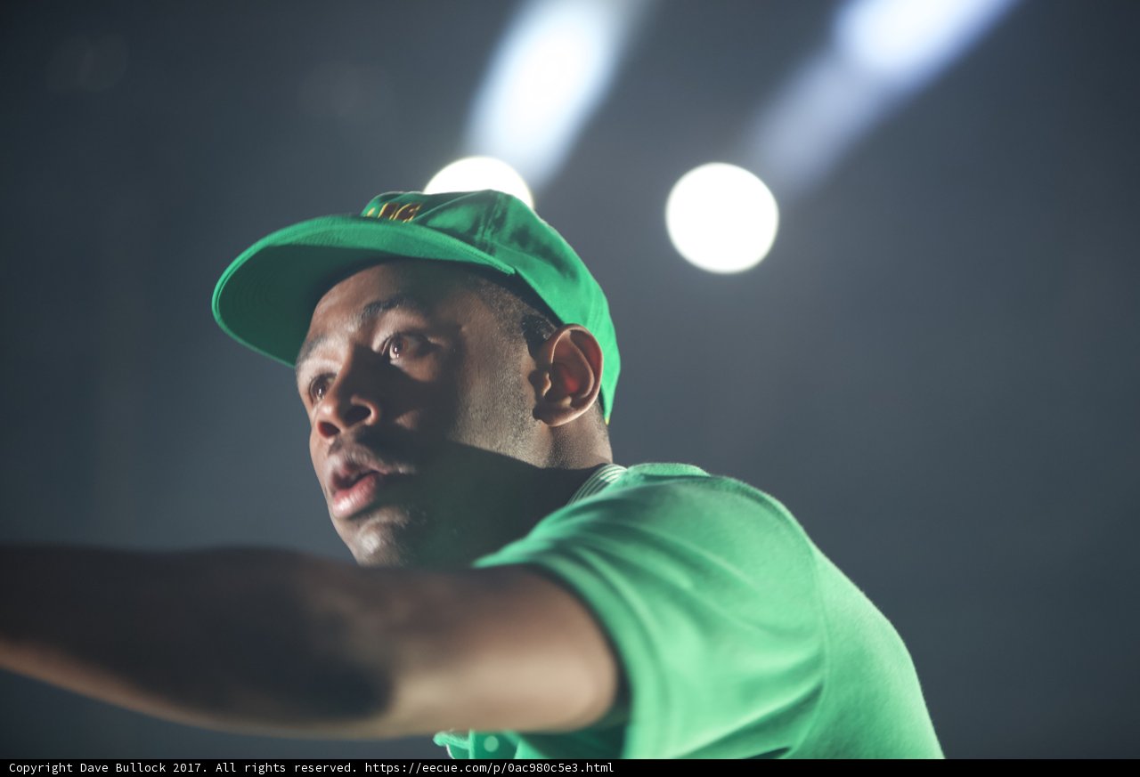 Tyler, The Creator rocks a green cap on stage