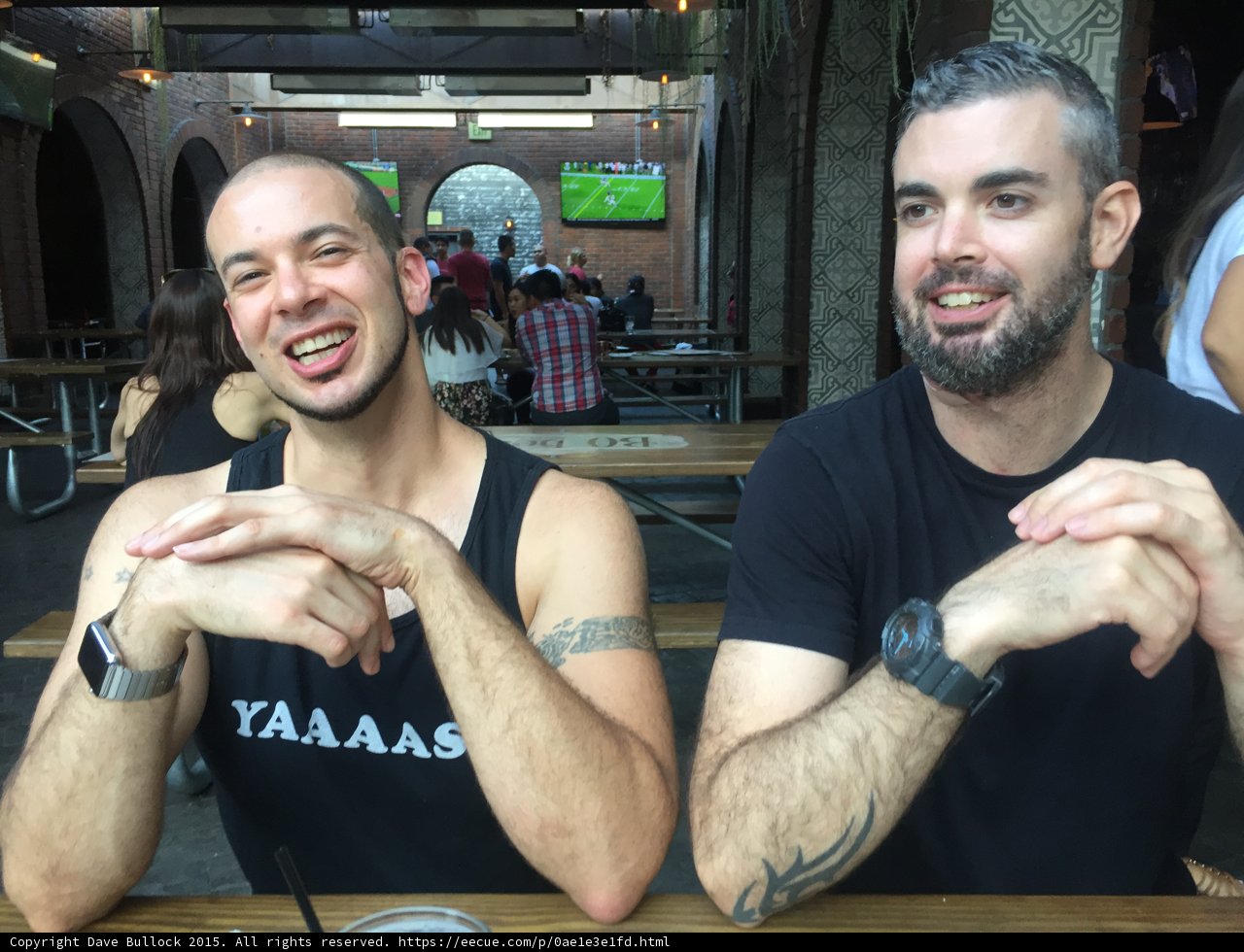 Two Men Sharing a Moment at a Table in Long Beach