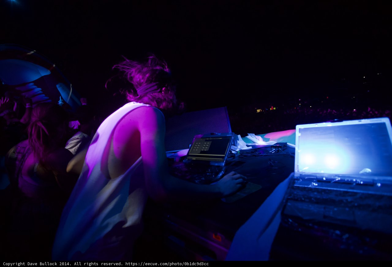 Woman Rocks the Nightlife with Her Laptops