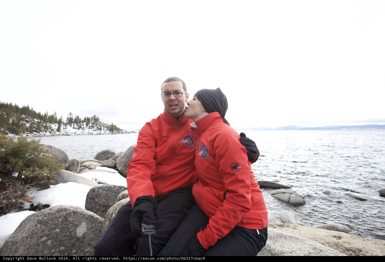 Couple Shares Playful Kiss at Lake Tahoe Shore