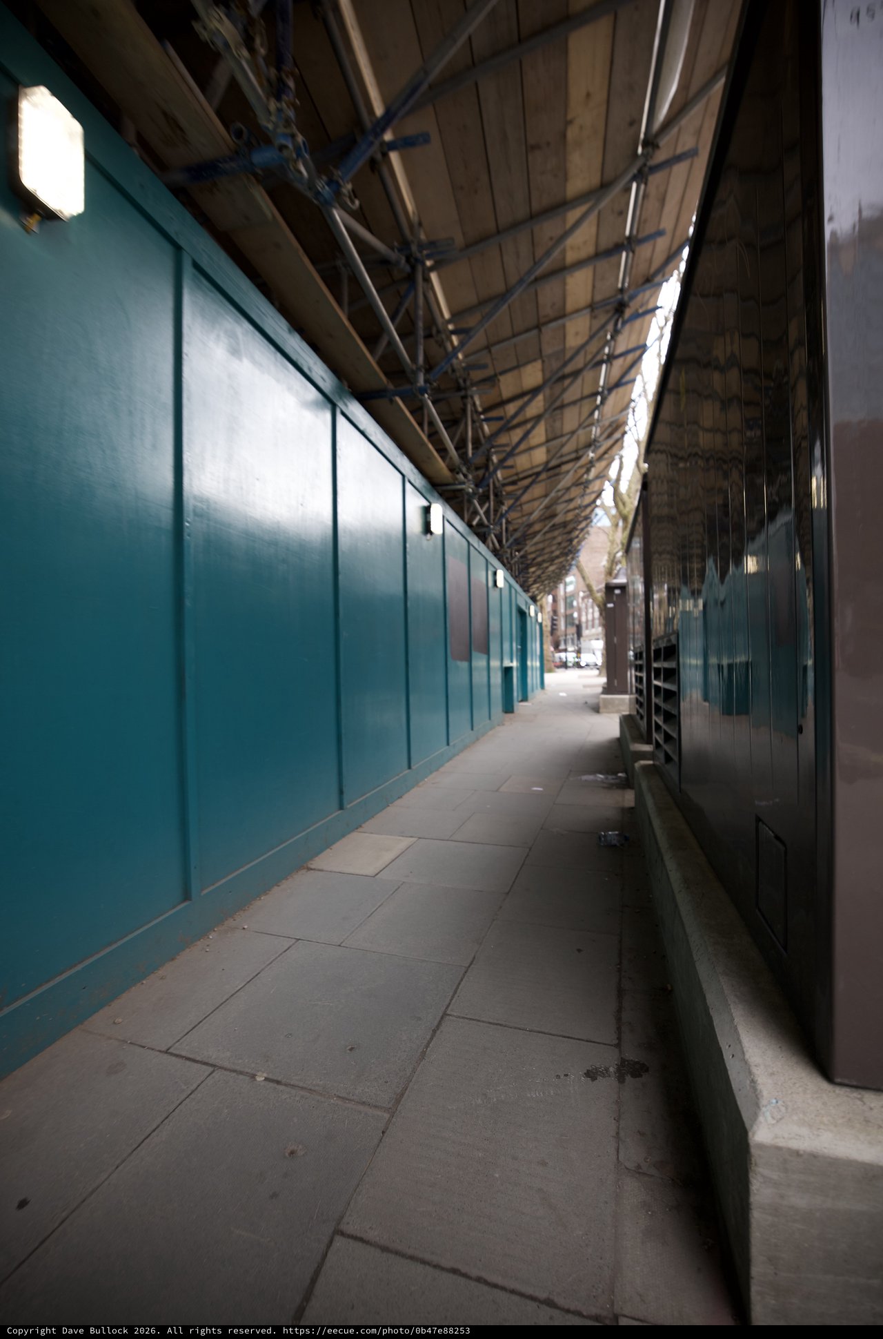 Empty Covered Walkway with Turquoise Walls in London