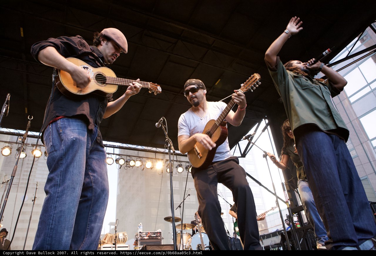 Three Guitarists Rocking the Crowd
