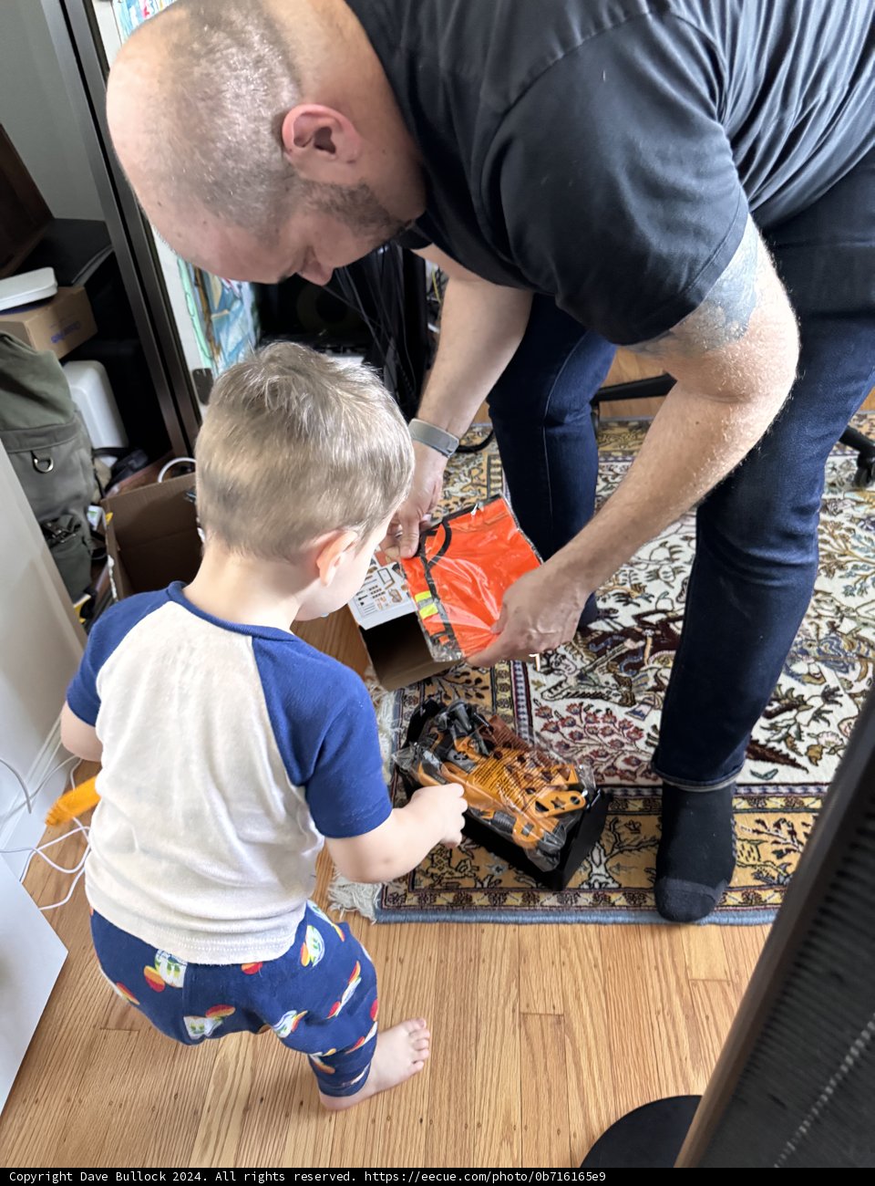 Father and Son Unwrapping Joy