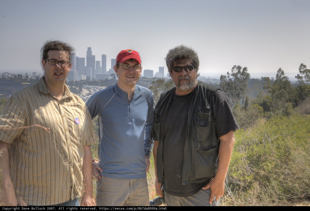 Three Men Enjoying a Sunny Day Outdoors