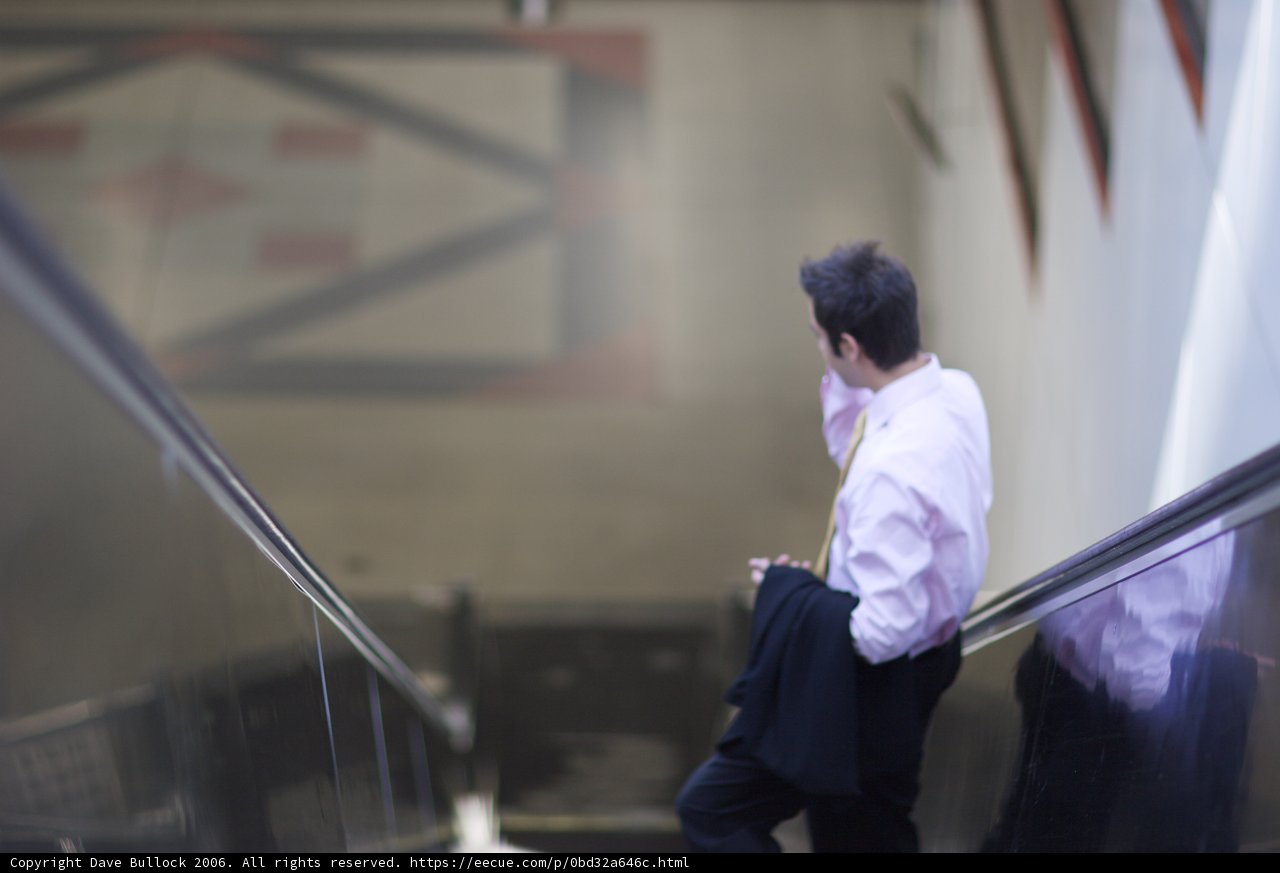 Pink Shirted Man at the Staircase