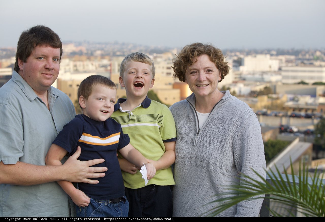 Family Portrait on Urban Rooftop at Dusk