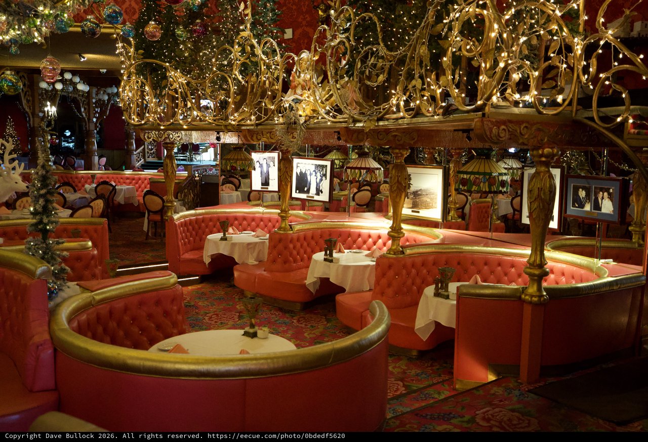 Opulent Holiday-Decorated Restaurant with Circular Booth Seating