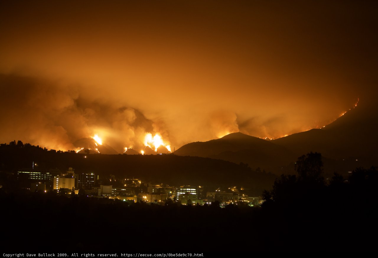 City Lights vs Mountain Fire