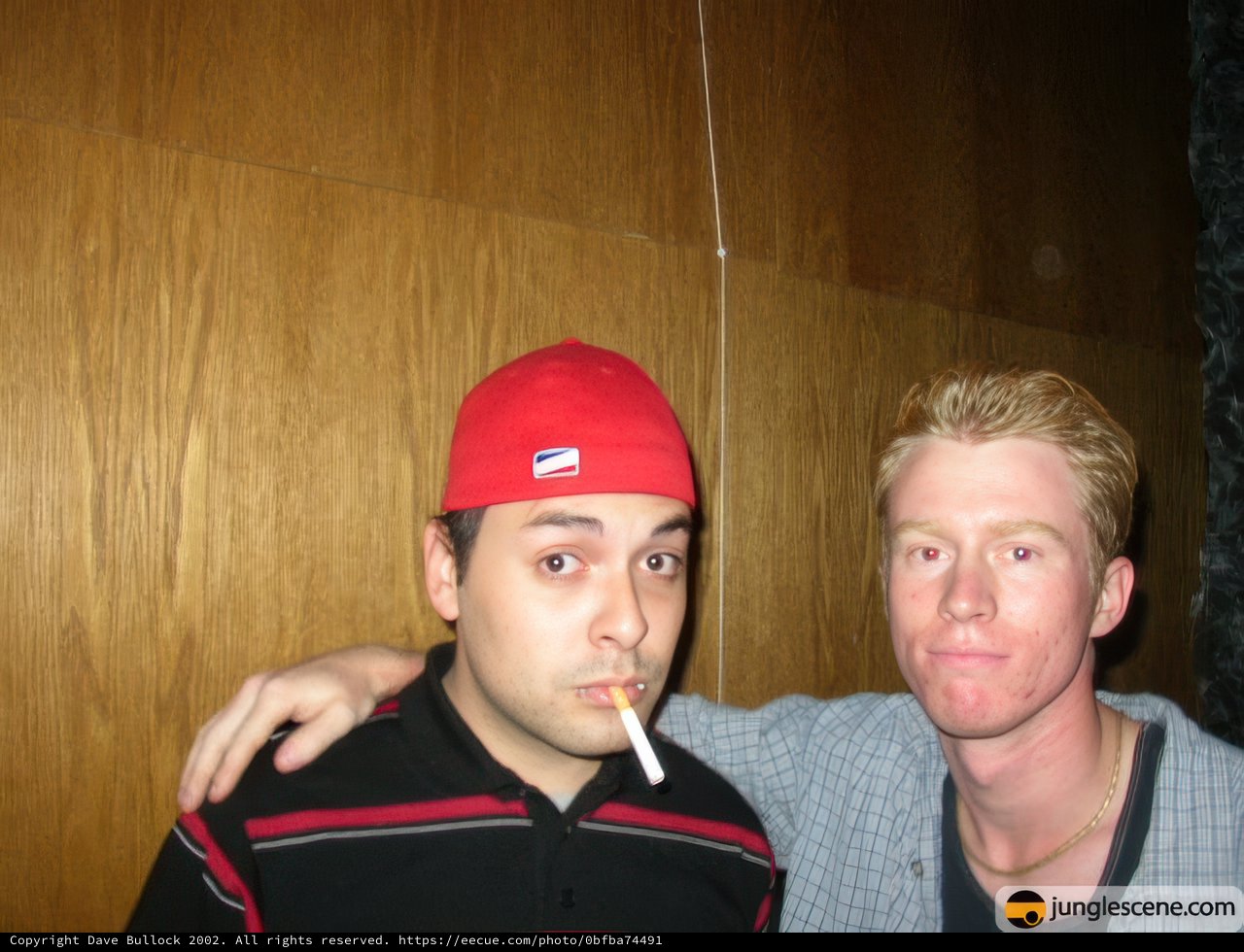 Two Men Wearing Baseball Caps