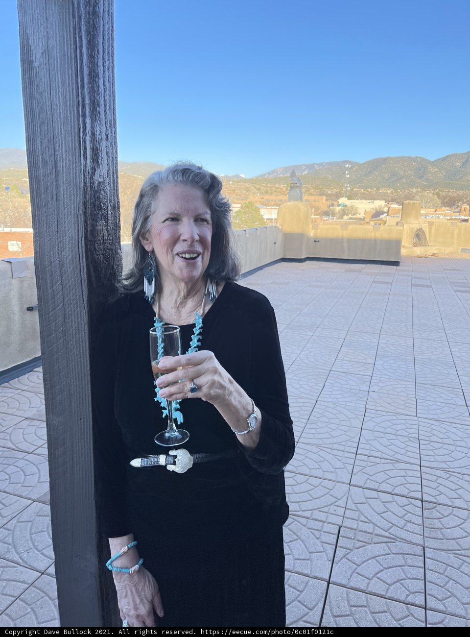 A Content Woman Enjoying a Glass of Wine Outdoors