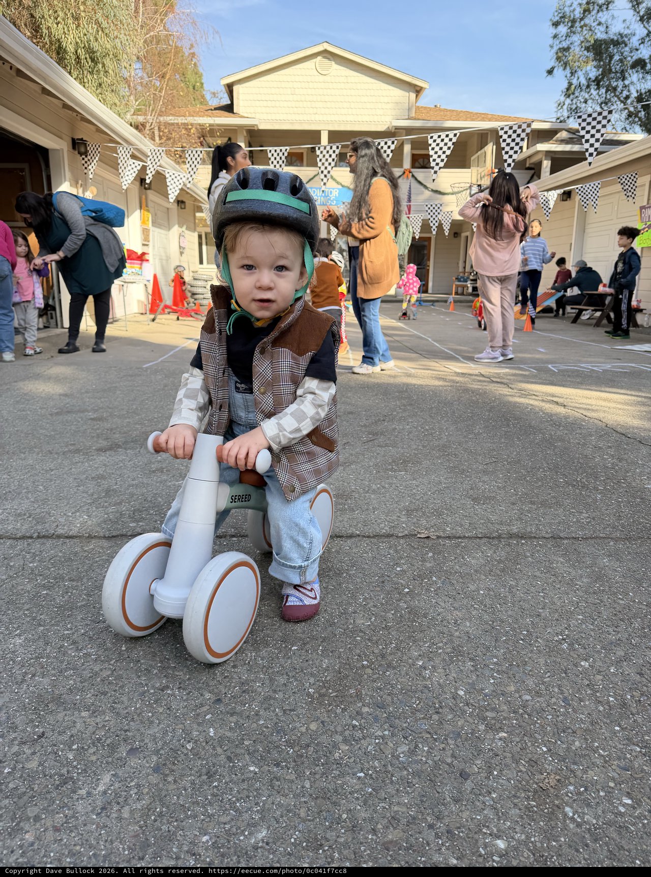 Toddler on Balance Bike at Community Event