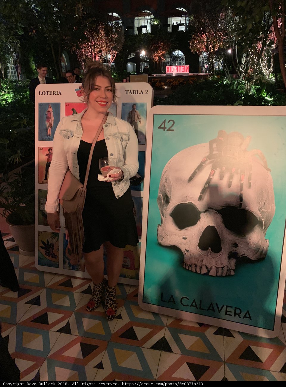 Woman Poses Next to Skull Poster