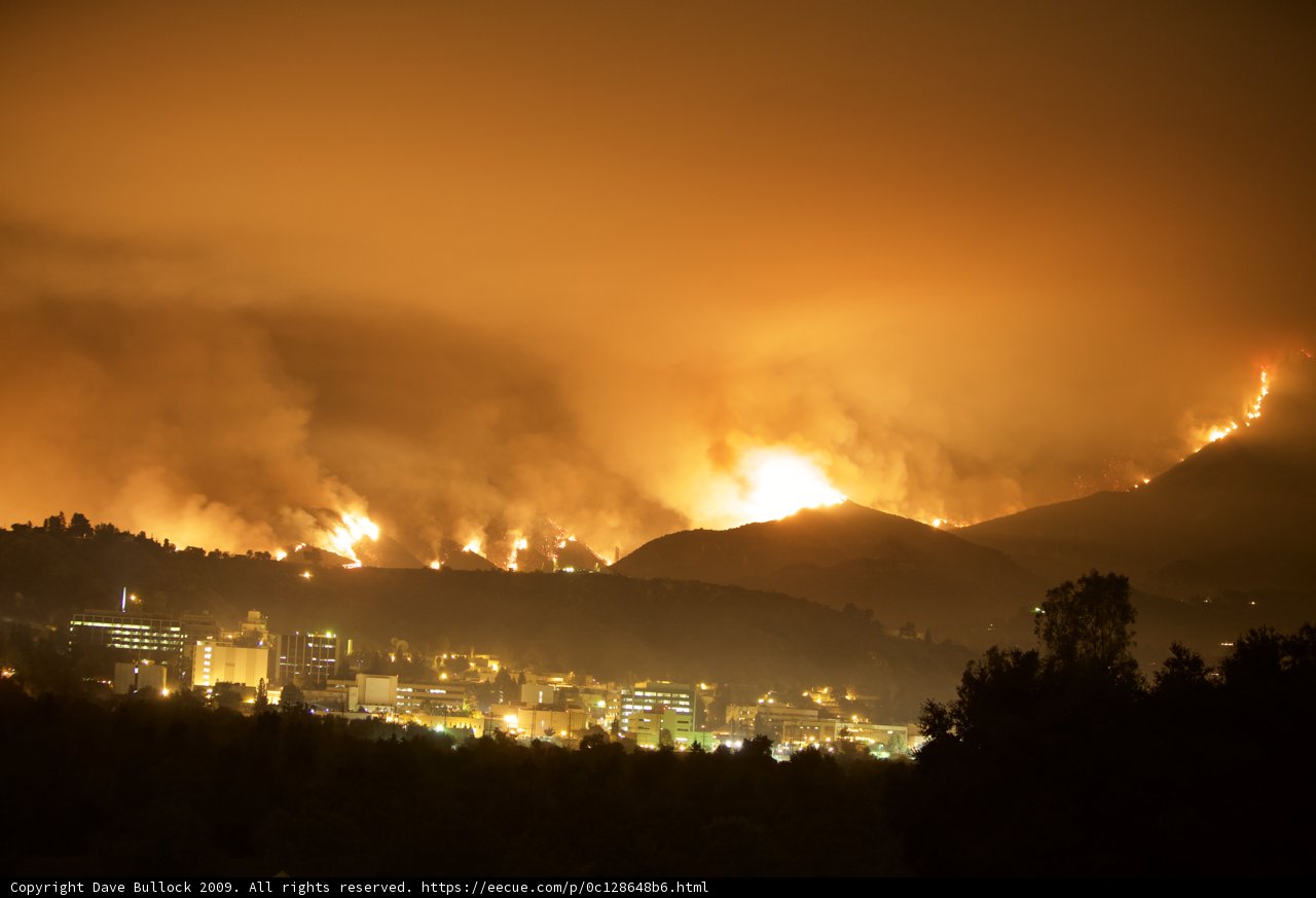 Flames Ravage Hills Above City