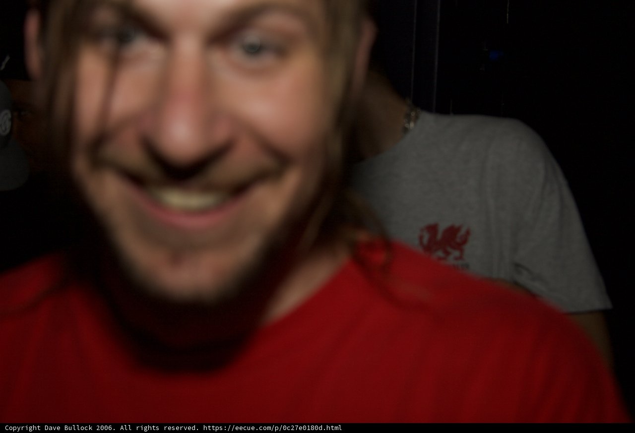 Smiling Man in Red T-Shirt