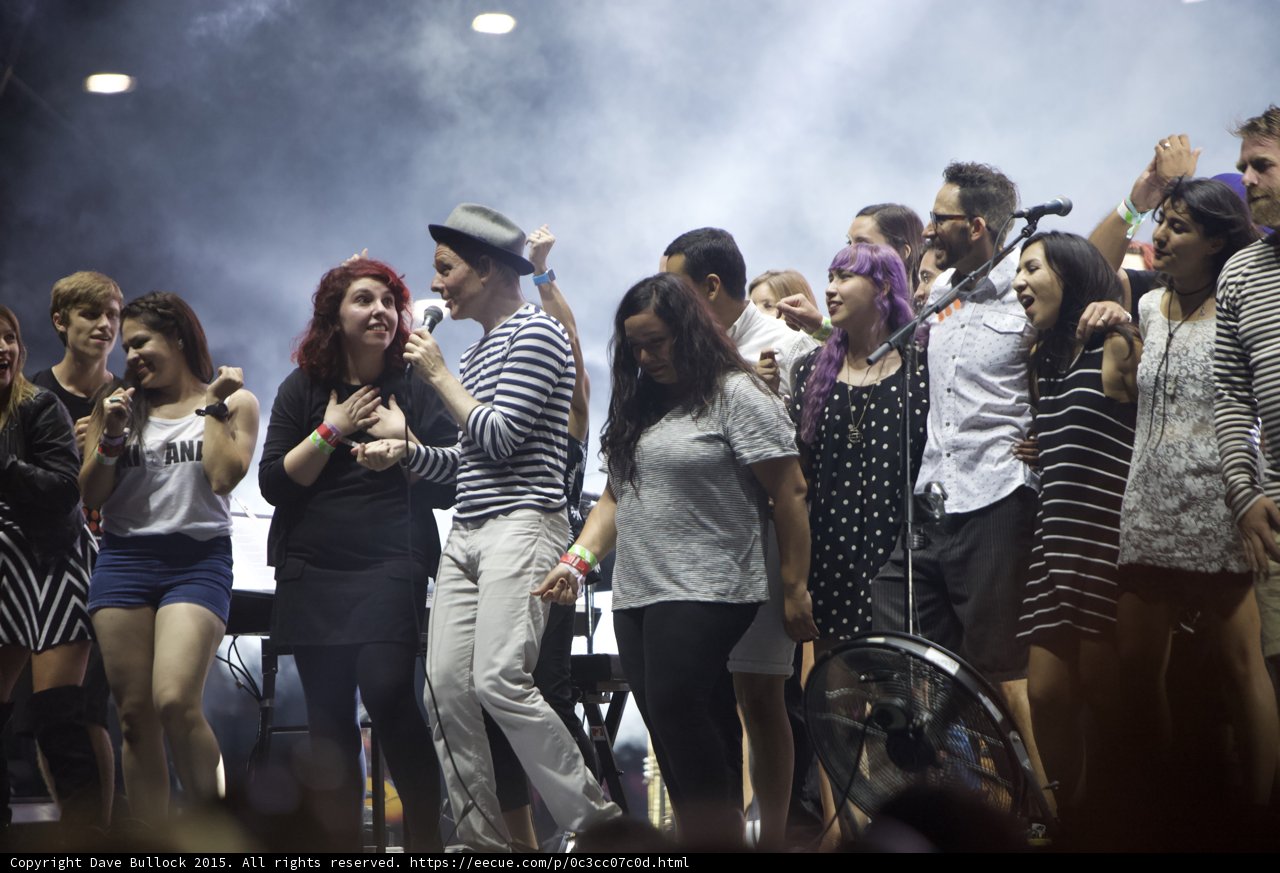 FYF Fest Stage Fedora Man Singing Red Hair Woman Smiling Purple Hair Haze Spotlight Finale