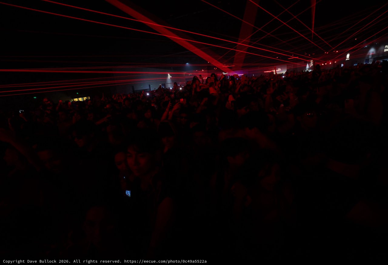 Red Laser Storm Over Pulsing Festival Crowd
