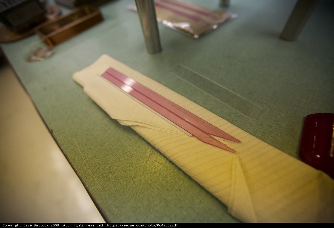 Pink Lined Paper on Hardwood Flooring