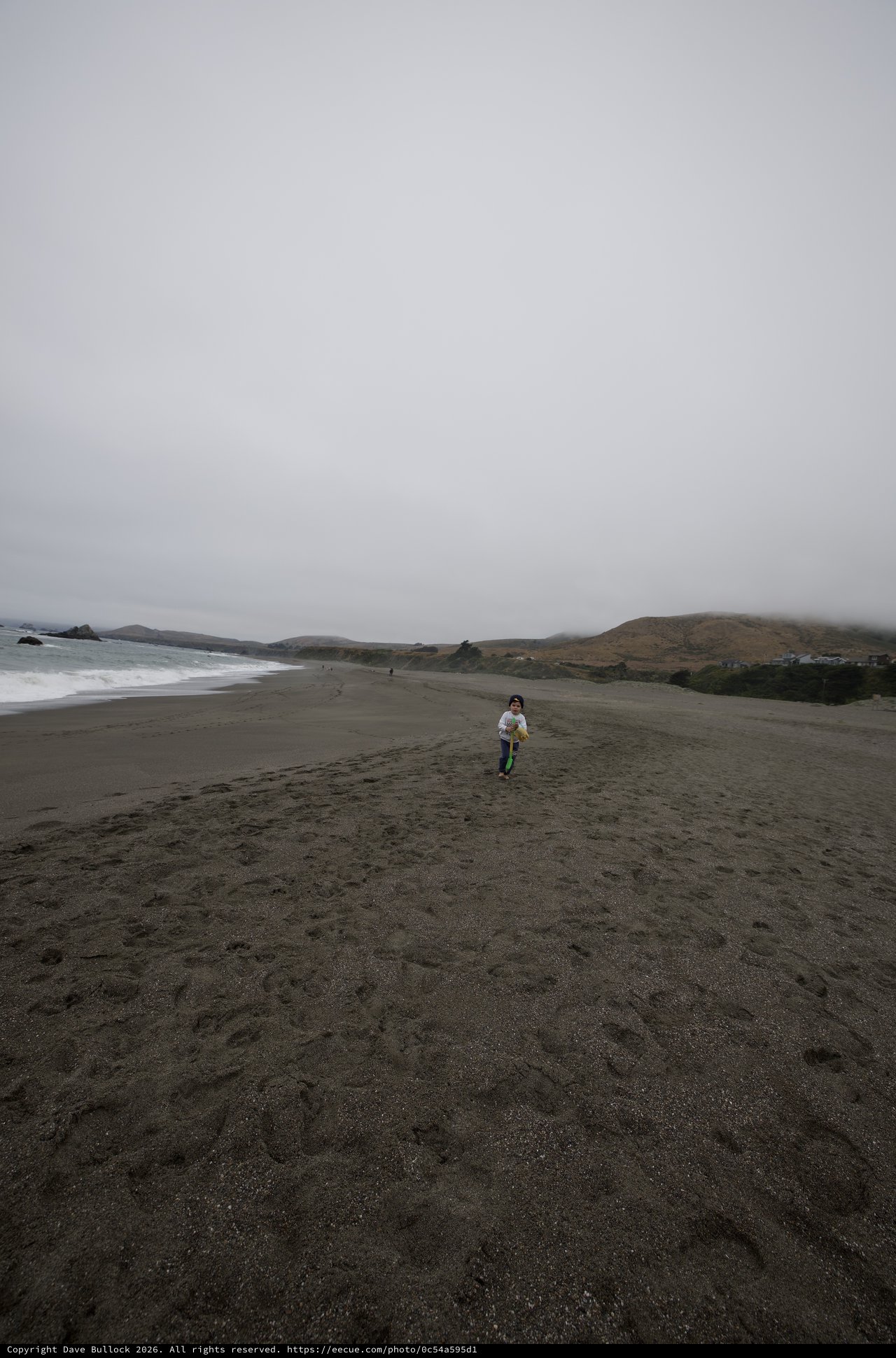 Child Running Free on Foggy Northern California Beach