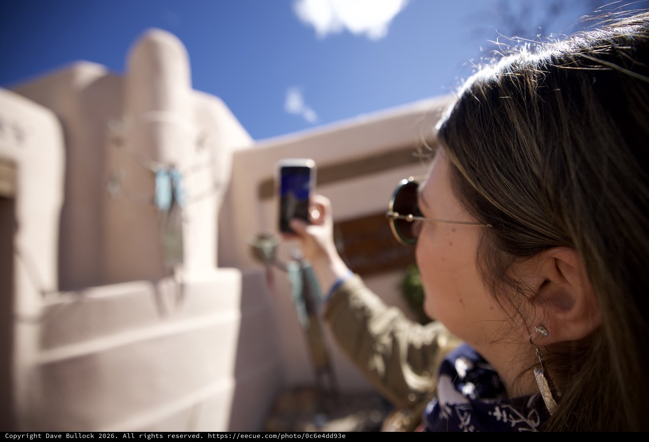 Tourist Photographing Adobe Architecture in Santa Fe