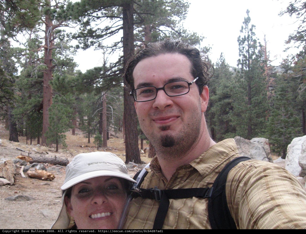 Hikers Pause for Selfie on Mountain Forest Trail