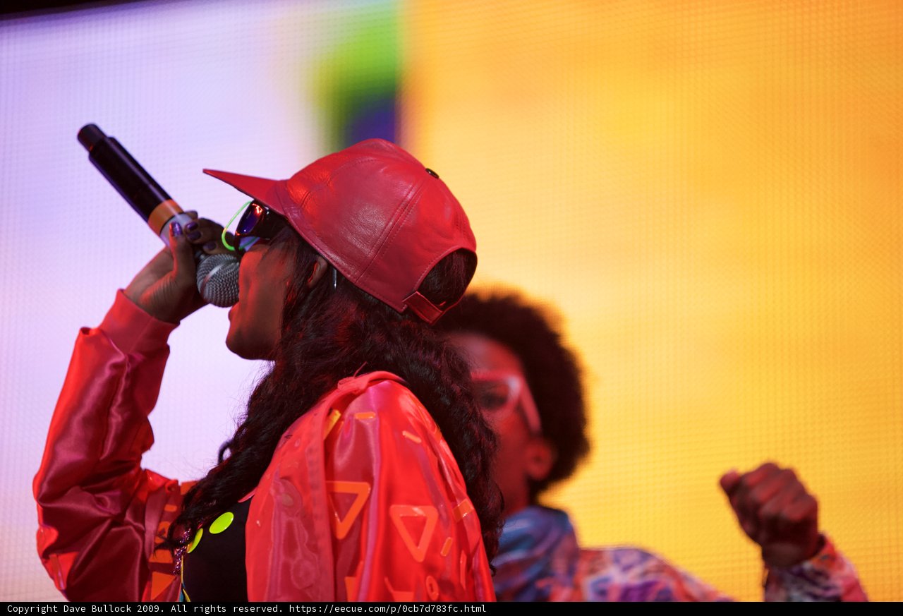 Red-Hatted Performer Belts Out Tunes