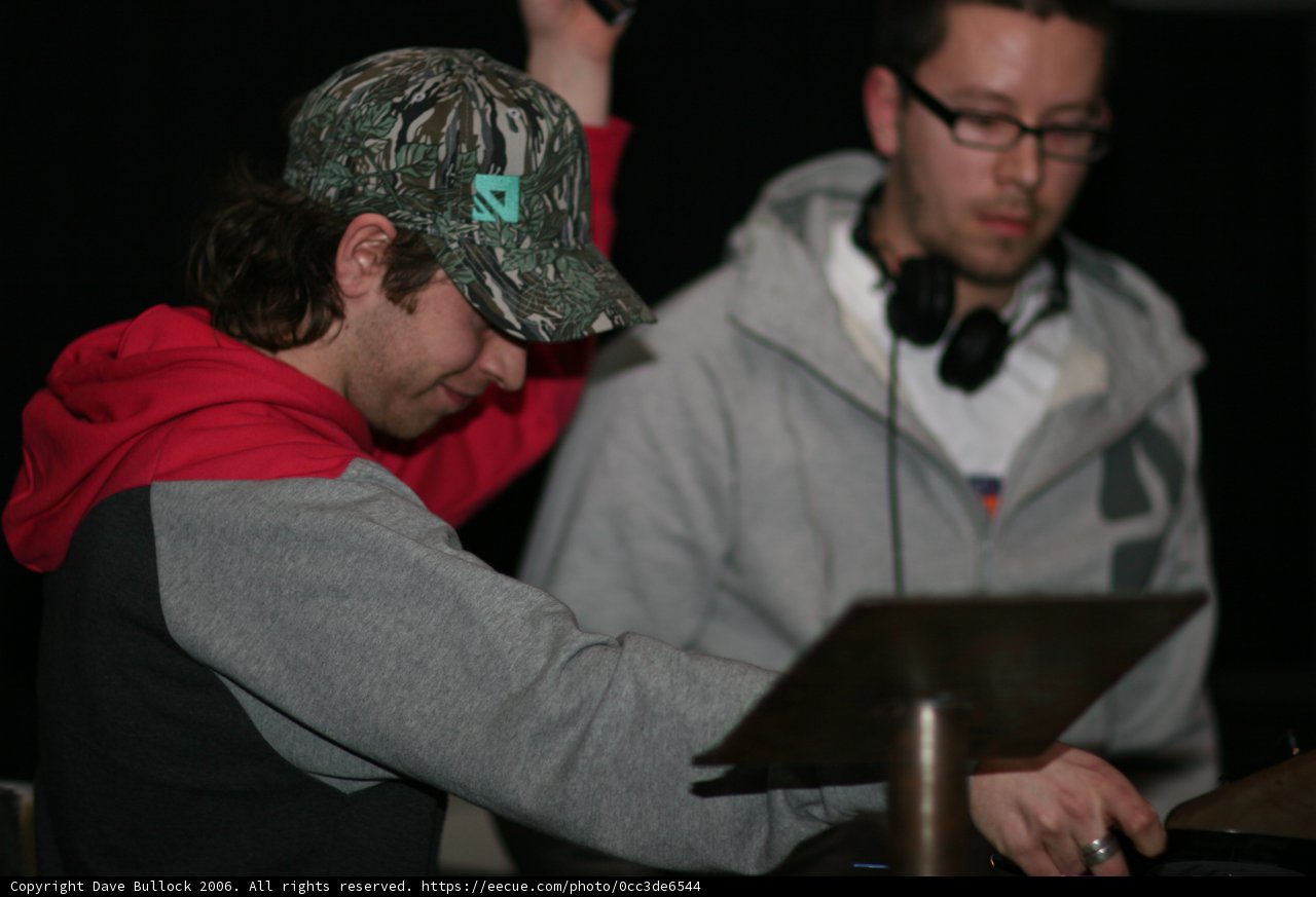 Two Men Discussing Music