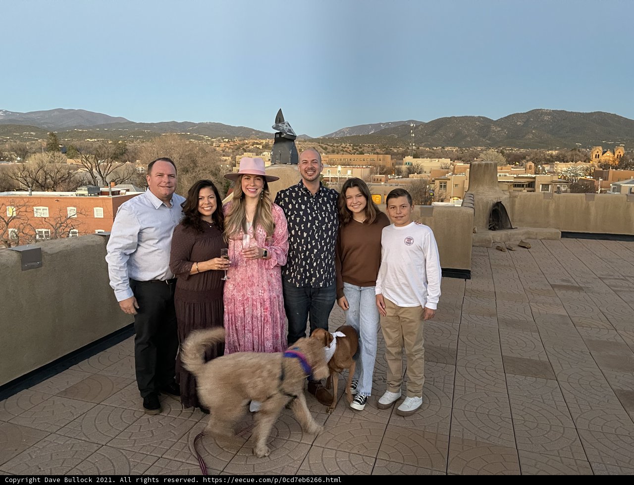 Family Portrait on the Rooftop with their Furry Friend