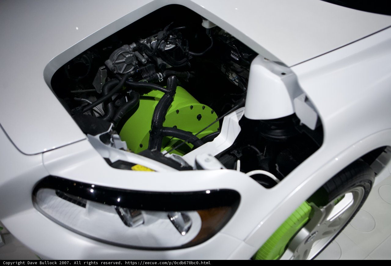 Under the Hood: A Look at the Engine Compartment of a Green Car