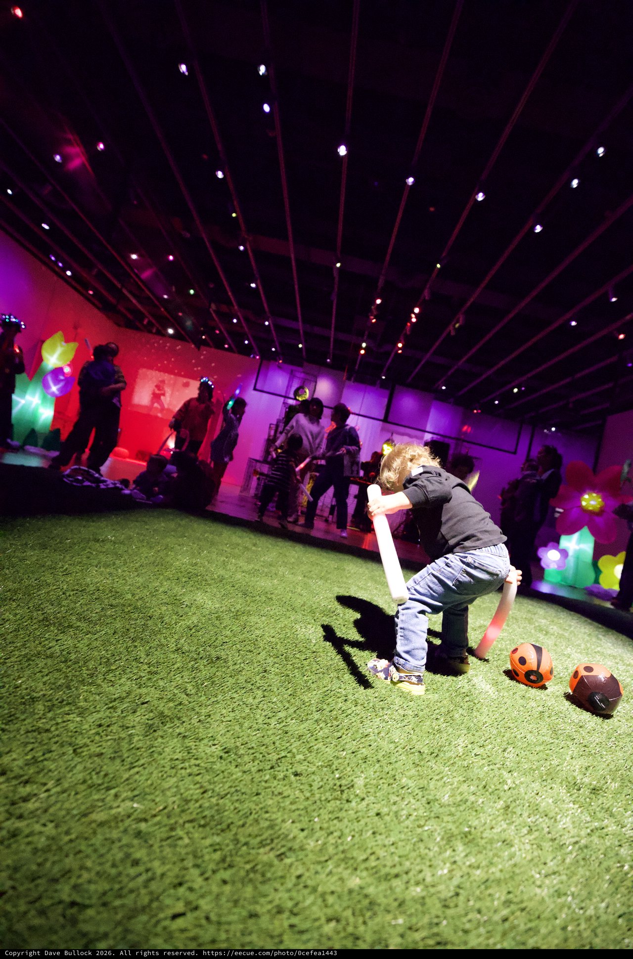 Child Playing at Baby Rave Event with Neon Lights