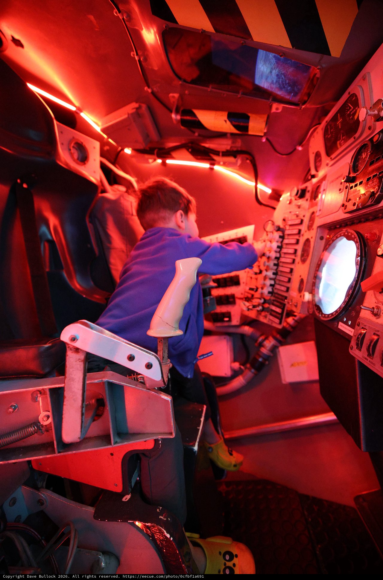 Young Visitor Operating Submarine Simulator at Science Center