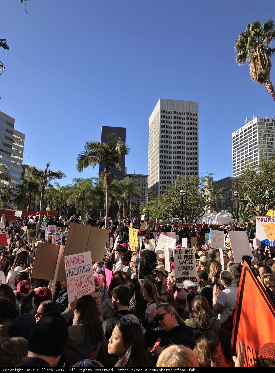 Protesters rally against a building in Los Angeles