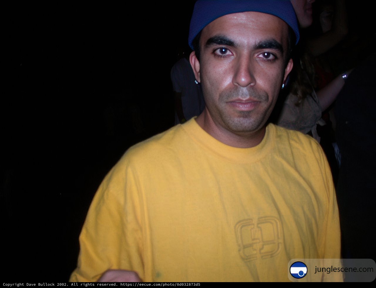 The Man with the Yellow Shirt and Blue Hat