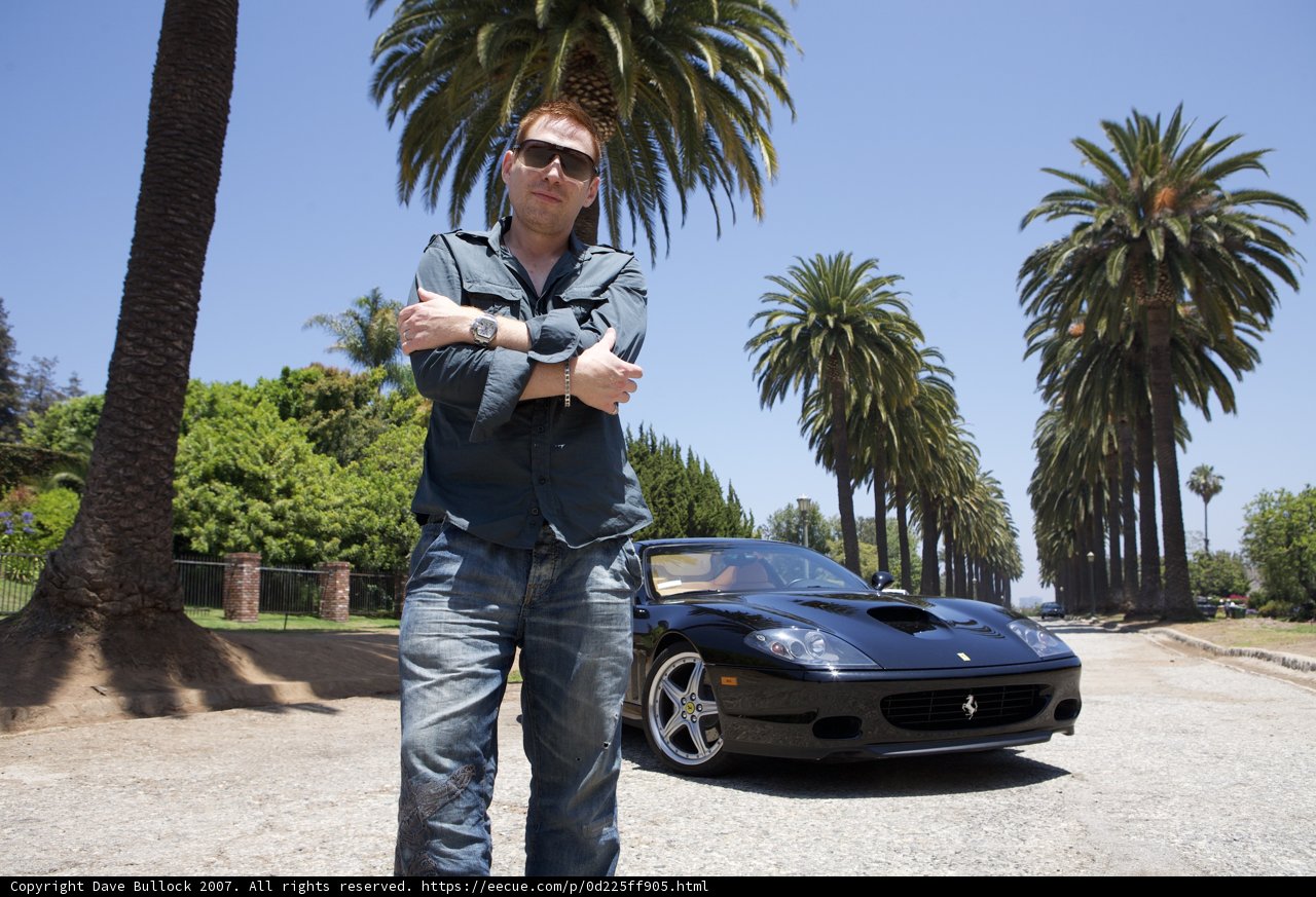 Standing Tall with His Sportscar
