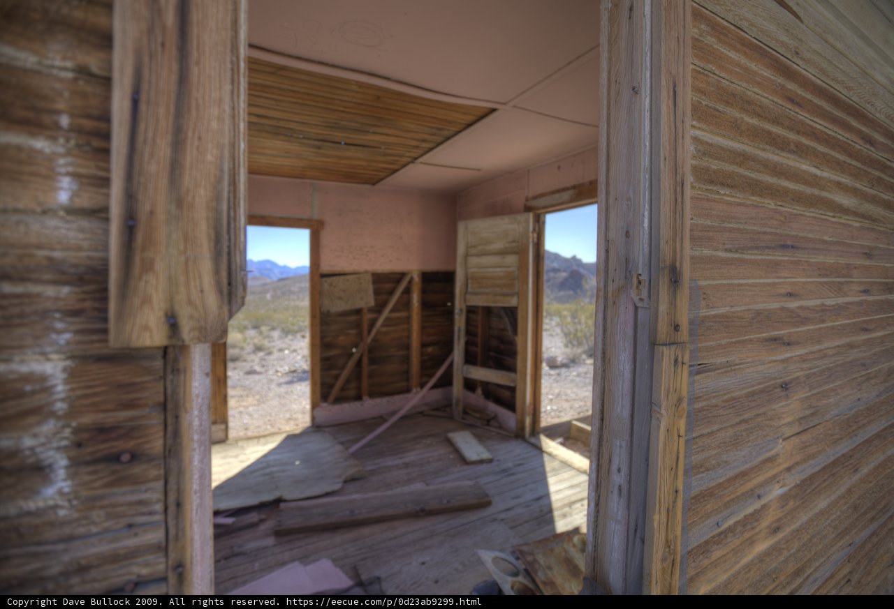 Abandoned Plywood House with Open Door