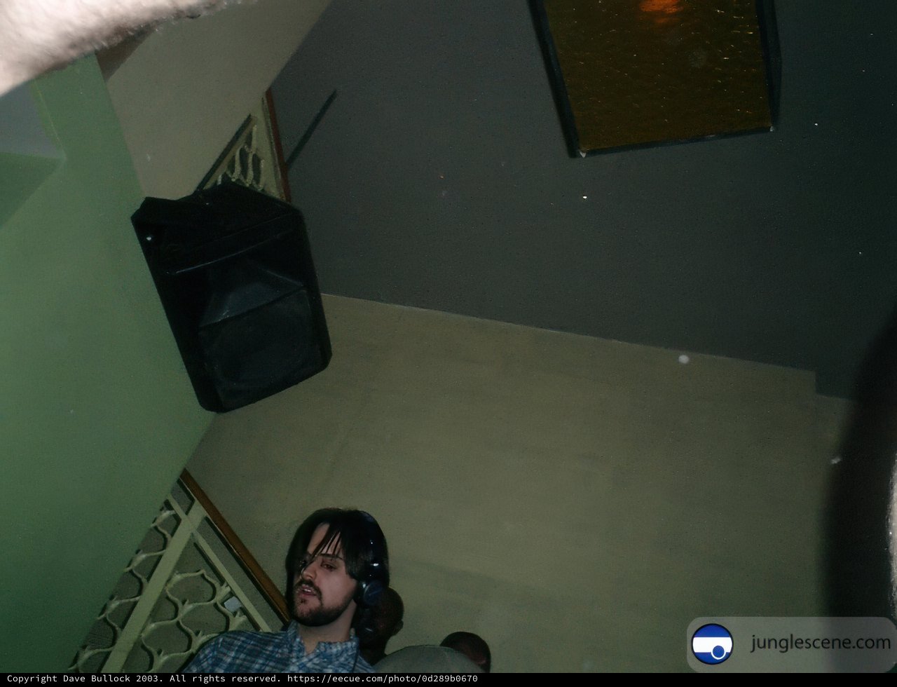 Musician posing with a speaker