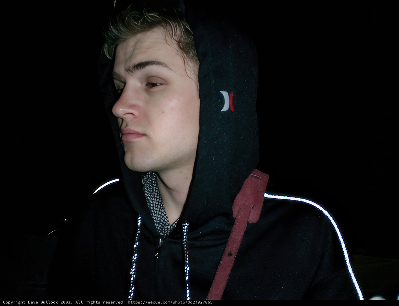 Hooded Man Captivated by Art