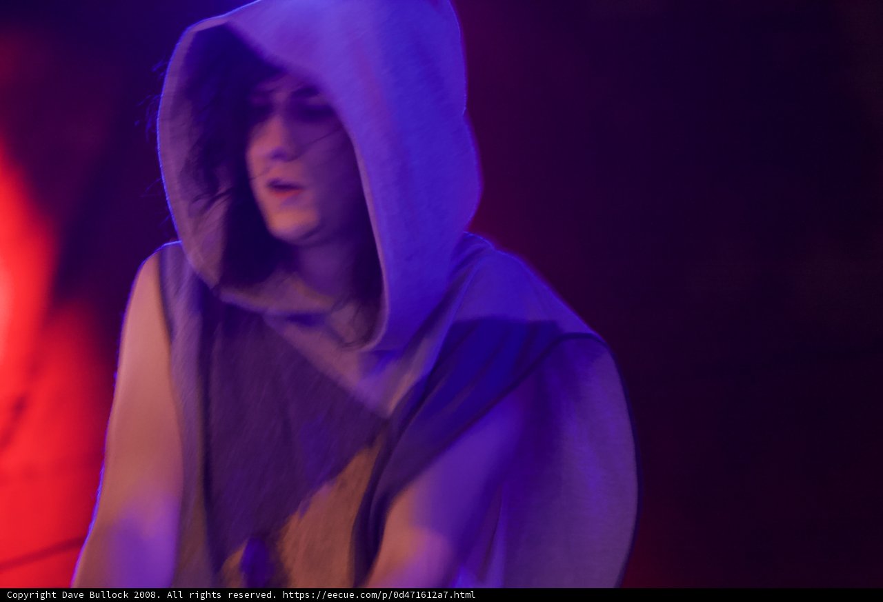 Hooded Woman Takes the Stage