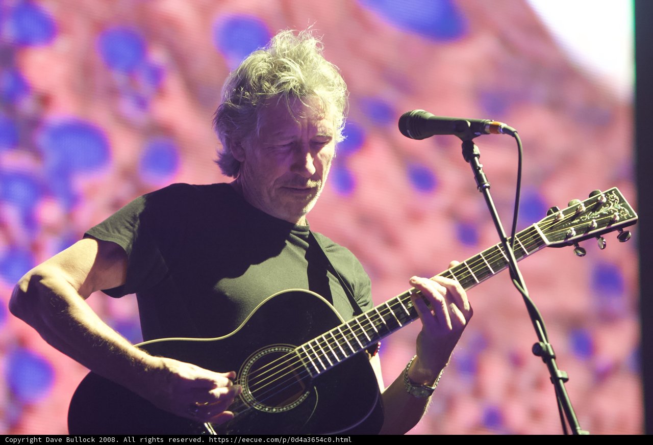 Roger Waters strums guitar at Coachella