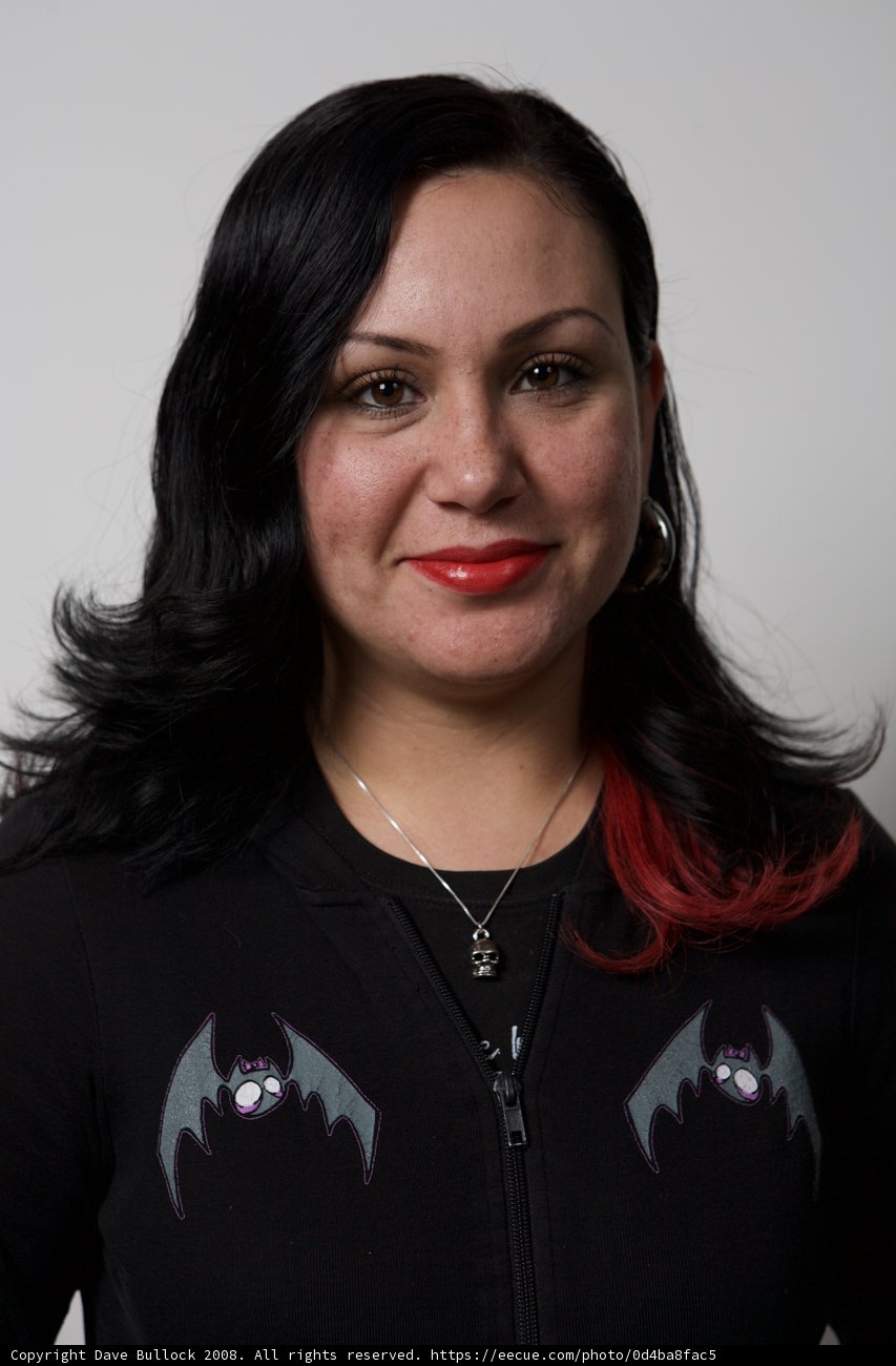 Red Haired Woman in Bat-themed Shirt
