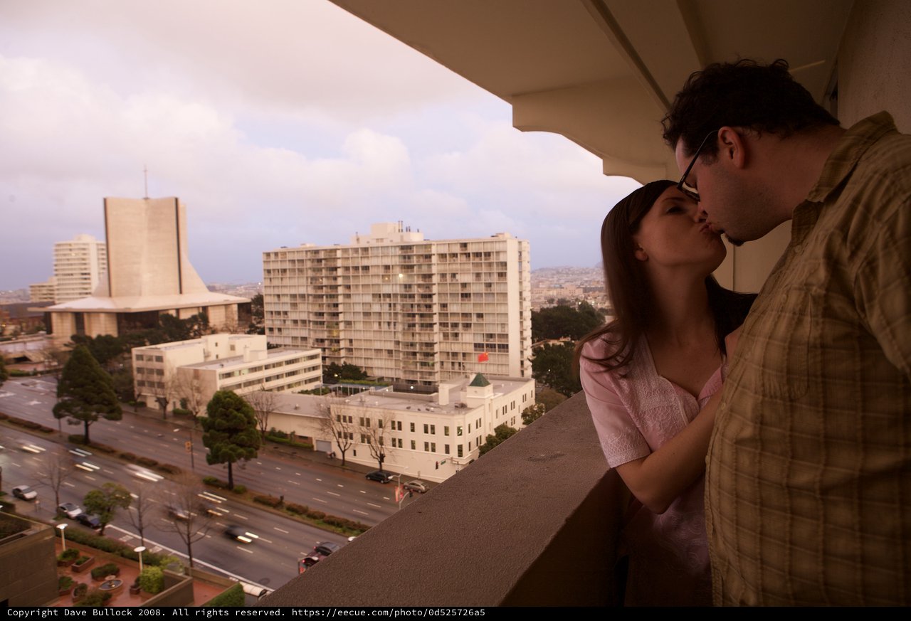 Romantic Kiss on a San Francisco Hotel Balcony