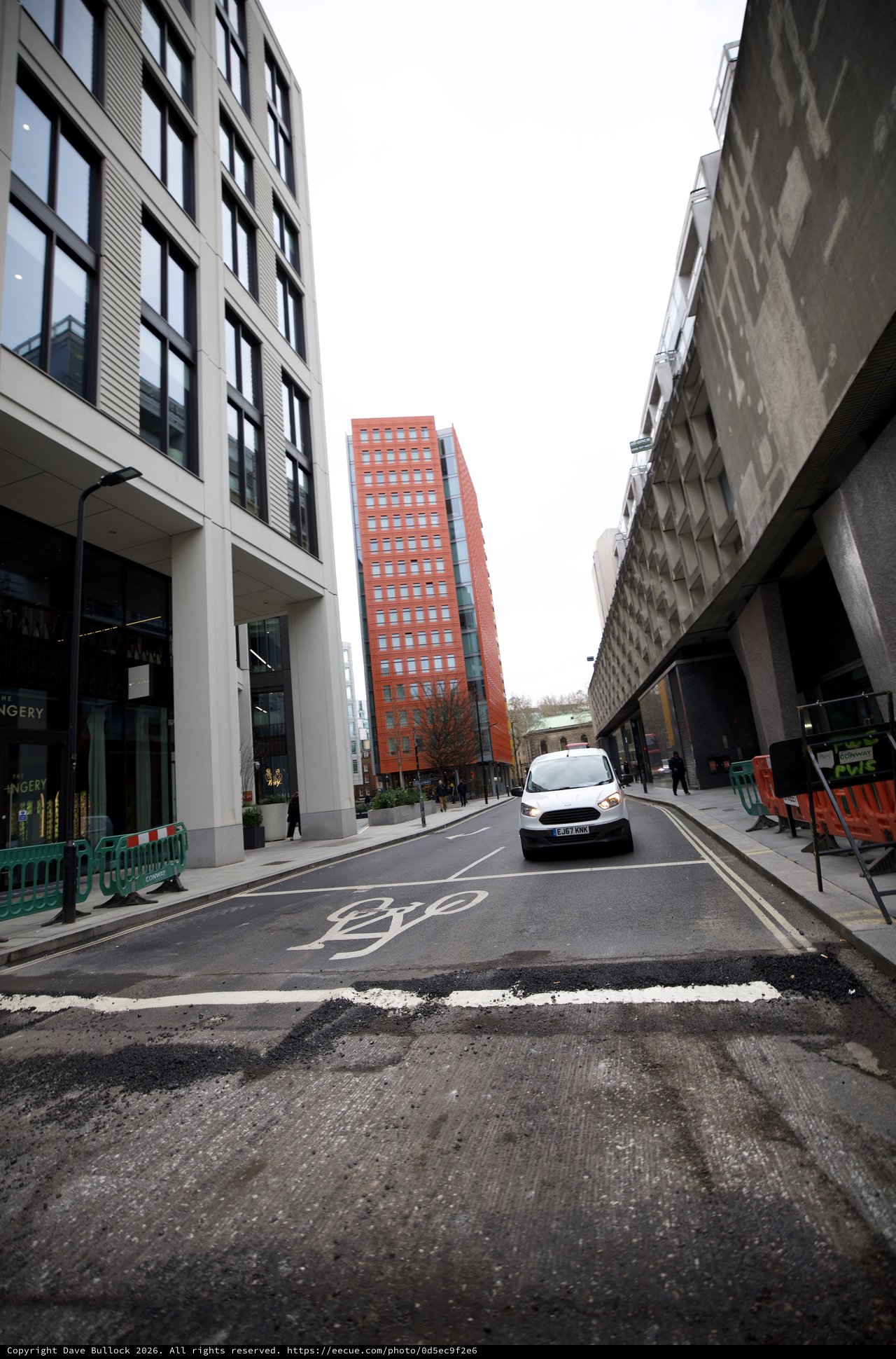 Modern Urban Street Scene with Red Brick Tower