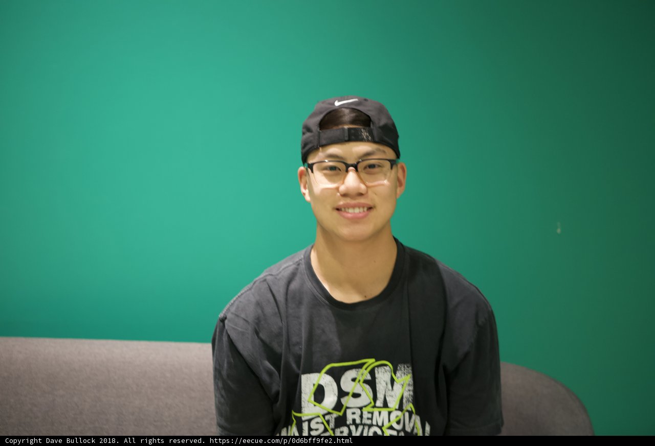 Young Man in Black Shirt and Hat