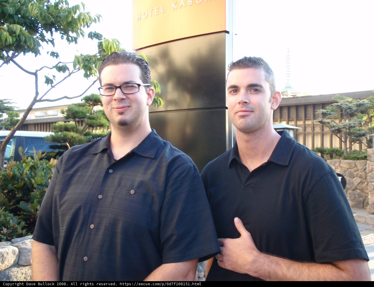 Two Men in Black Shirts