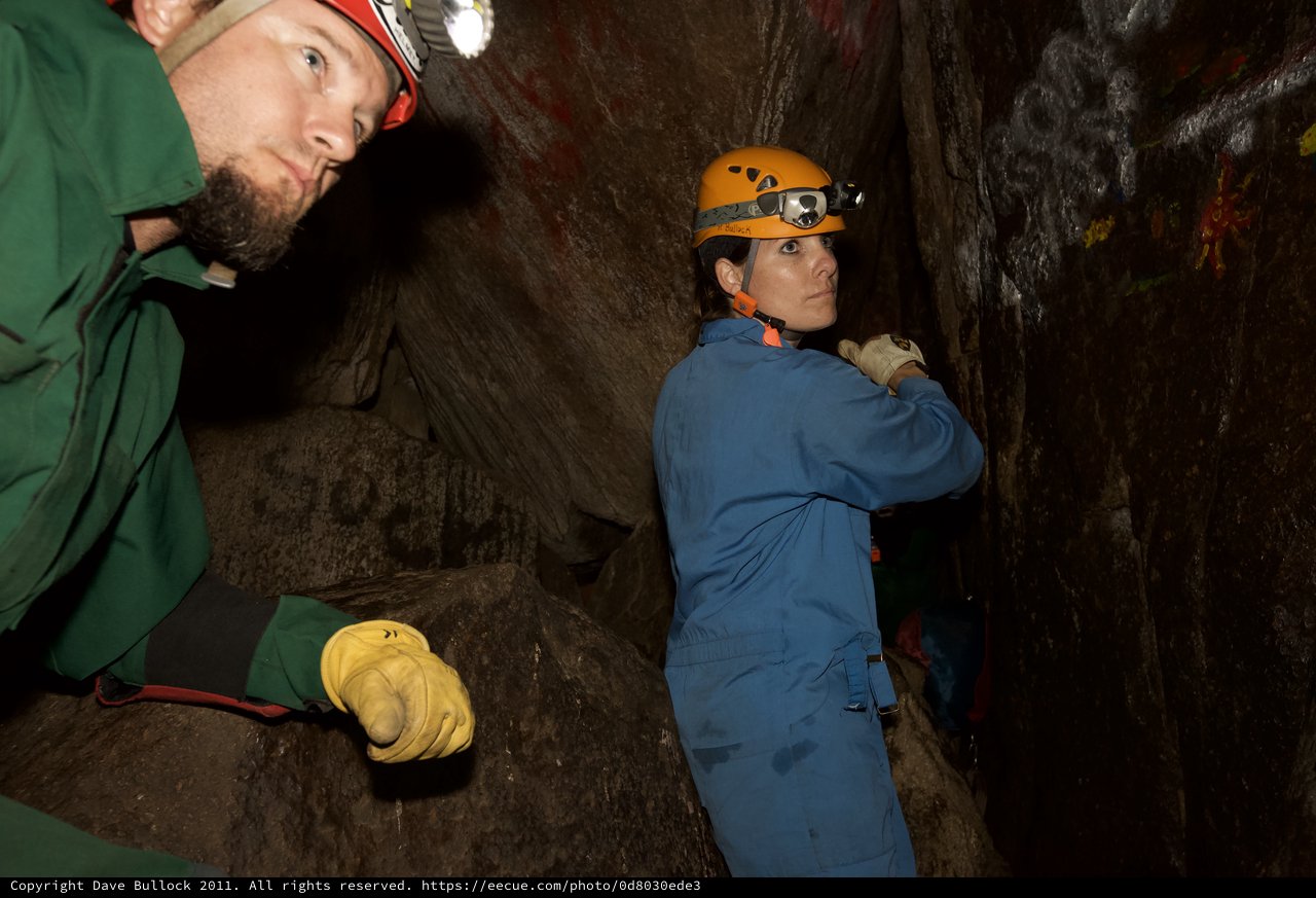 Cavers Navigate Tight Underground Passage Together