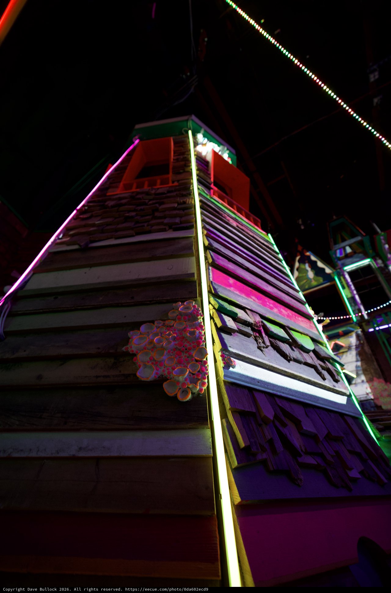 Neon-Lit Tower at Night Amusement Ride